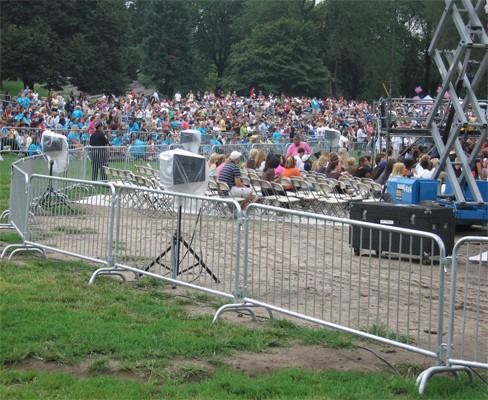 pedestrian barriers at a crowded outdoor concert