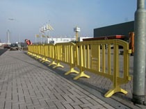 yellow temporary pedestrian barriers